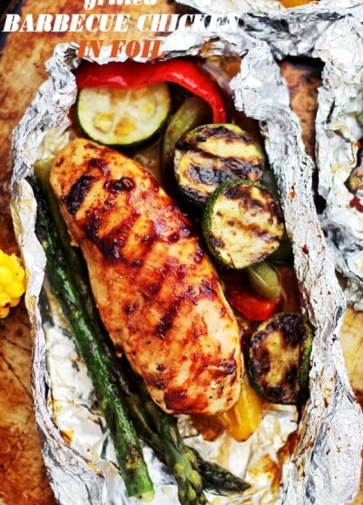 Grilled Barbecue Chicken and Vegetables in Foil - Tender, flavorful chicken covered in sweet barbecue sauce and cooked on the grill inside foil packs with zucchini, bell peppers and asparagus.