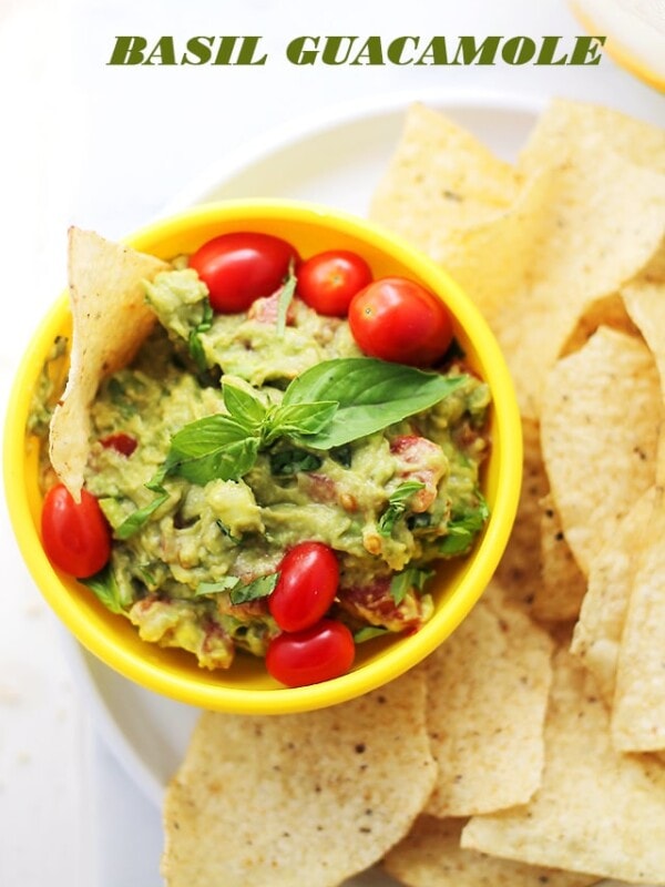 Basil Guacamole - A delicious twist on the classic guacamole made with fresh basil, tomatoes, onions and lime.