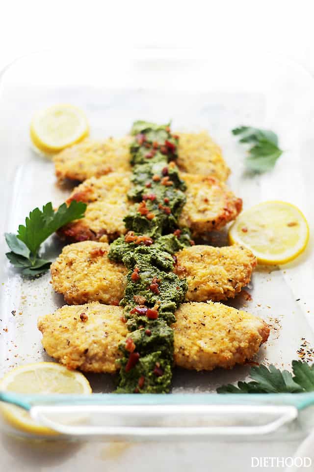 Breaded Baked Pork Chops with Bacon-Kale Pesto - Tender and delicious Pork Chops coated in oyster crackers and cheese served with a side of a truly mouthwatering homemade Bacon-Kale Pesto. 
