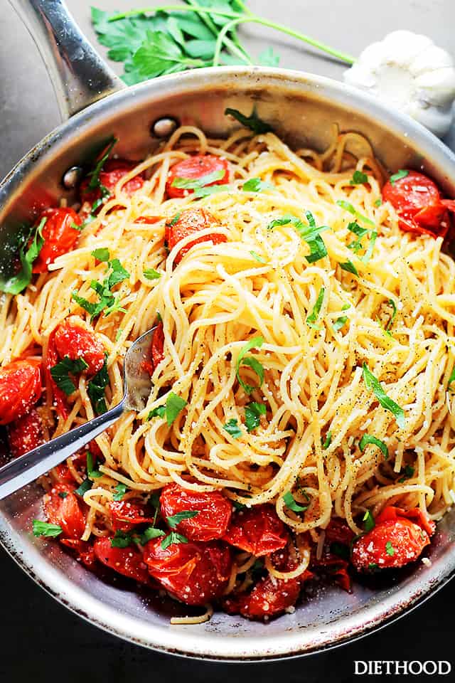Overhead image of Garlic Parmesan Spaghetti with Blistered Tomatoes in a skillet.