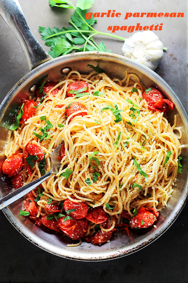 Garlic Parmesan Spaghetti with Blistered Tomatoes - Tossed in roasted garlic oil, blistered tomatoes and a handful of parmesan cheese, these easy, 20-minute Garlic Parmesan Spaghetti are your best bet! YET!