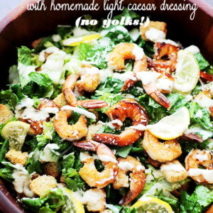 Grilled Shrimp Caesar Salad with Homemade Light Caesar Dressing - Crunchy and creamy classic caesar salad tossed with juicy grilled shrimp, garlic croutons, and a lightened-up, homemade caesar salad dressing made without egg yolks!