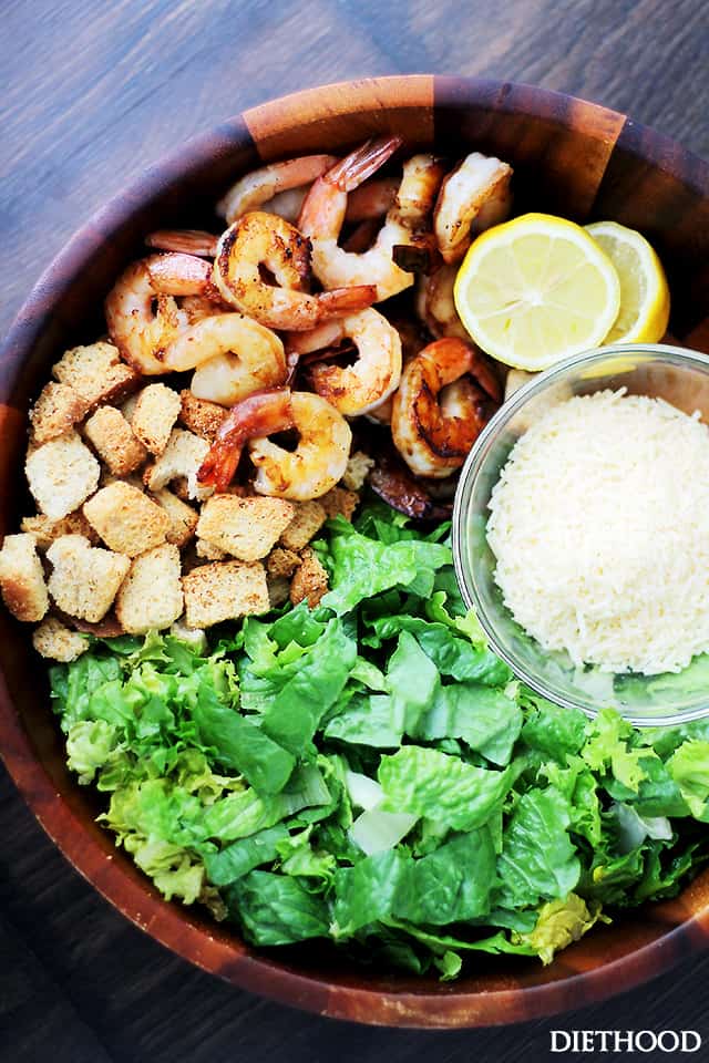 Grilled Shrimp Caesar Salad with Homemade Light Caesar Dressing - Crunchy and creamy classic caesar salad tossed with juicy grilled shrimp, garlic croutons, and a lightened-up, homemade caesar salad dressing made without egg yolks! 