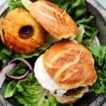 Grilled pineapple salmon burgers on toasted buns.