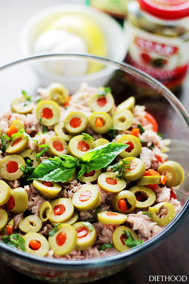 Tuna Pasta Salad with Pimiento-Stuffed Olives in a glass salad bowl. 