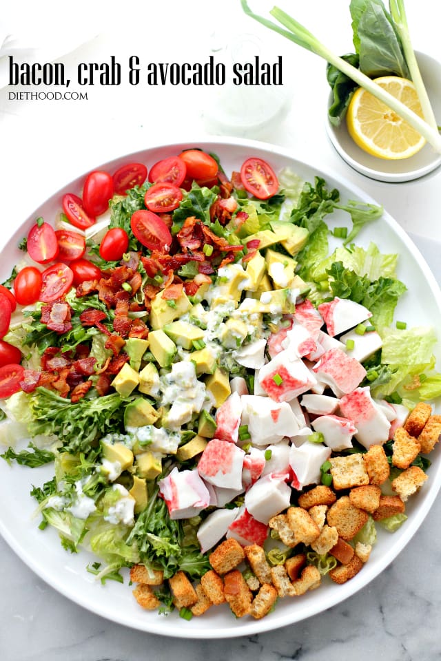 Overhead shot of Crab avocado salad arranged on a large white and round platter.