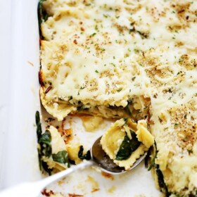 Spinach and Four Cheese Ravioli Lasagna | www.diethood.com | Layers of cheese-filled ravioli and fresh baby spinach covered in homemade alfredo sauce and topped with a crispy panko crumb-topping.