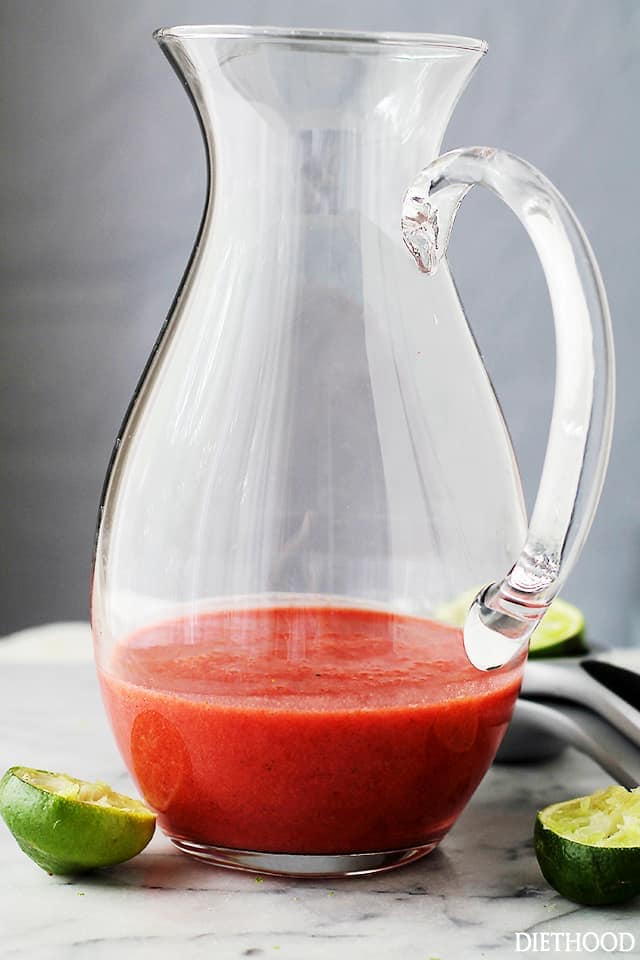 Strawberry limeade base in a pitcher.