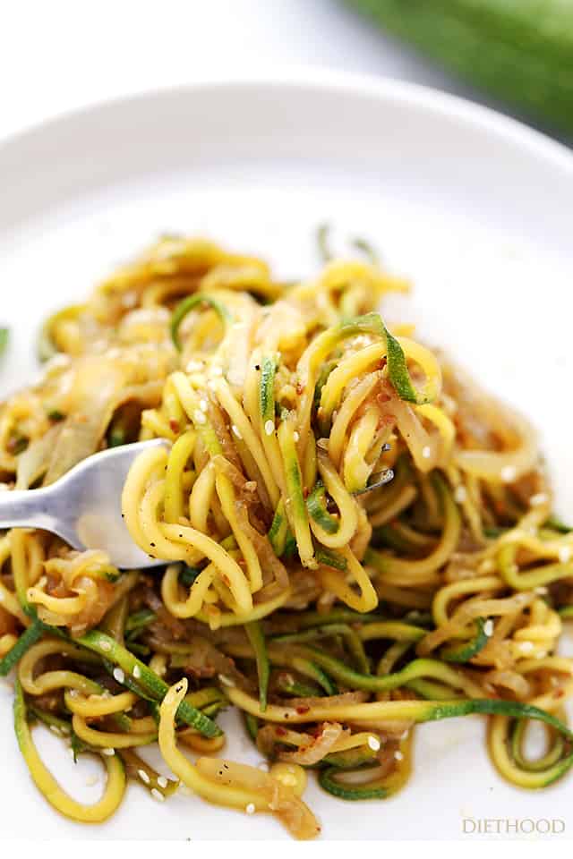 Stir Fry Zucchini Noodles in a bowl with a fork.