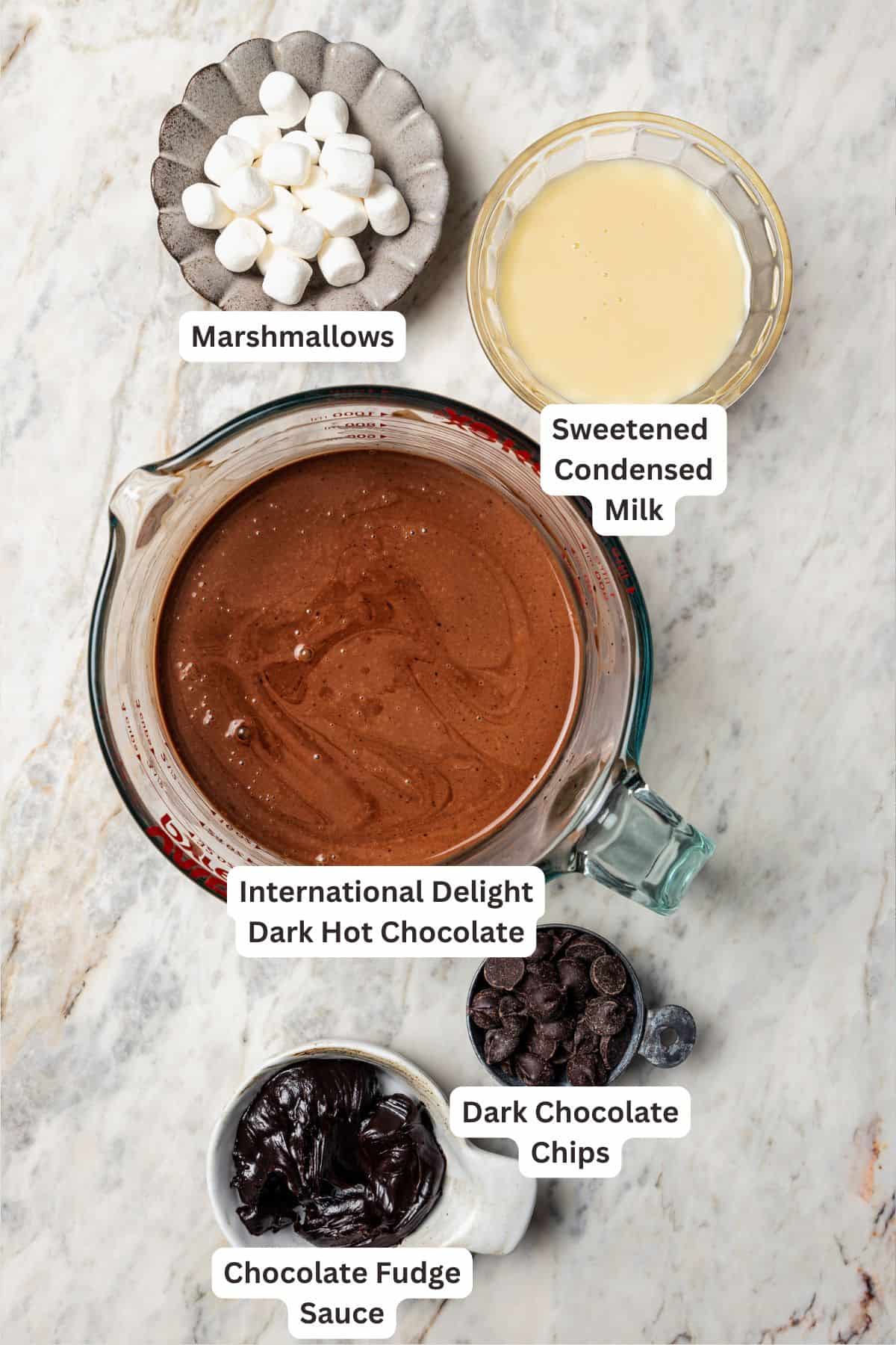 Dark hot chocolate ingredients with text labels overlaying each ingredient.