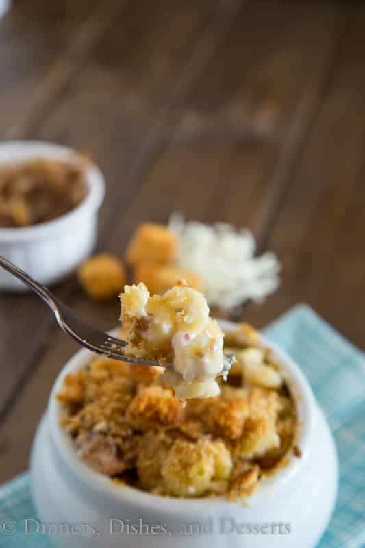 French onion mac and cheese with golden topping in a crock