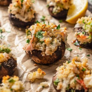 Crab stuffed mushrooms on a baking sheet.