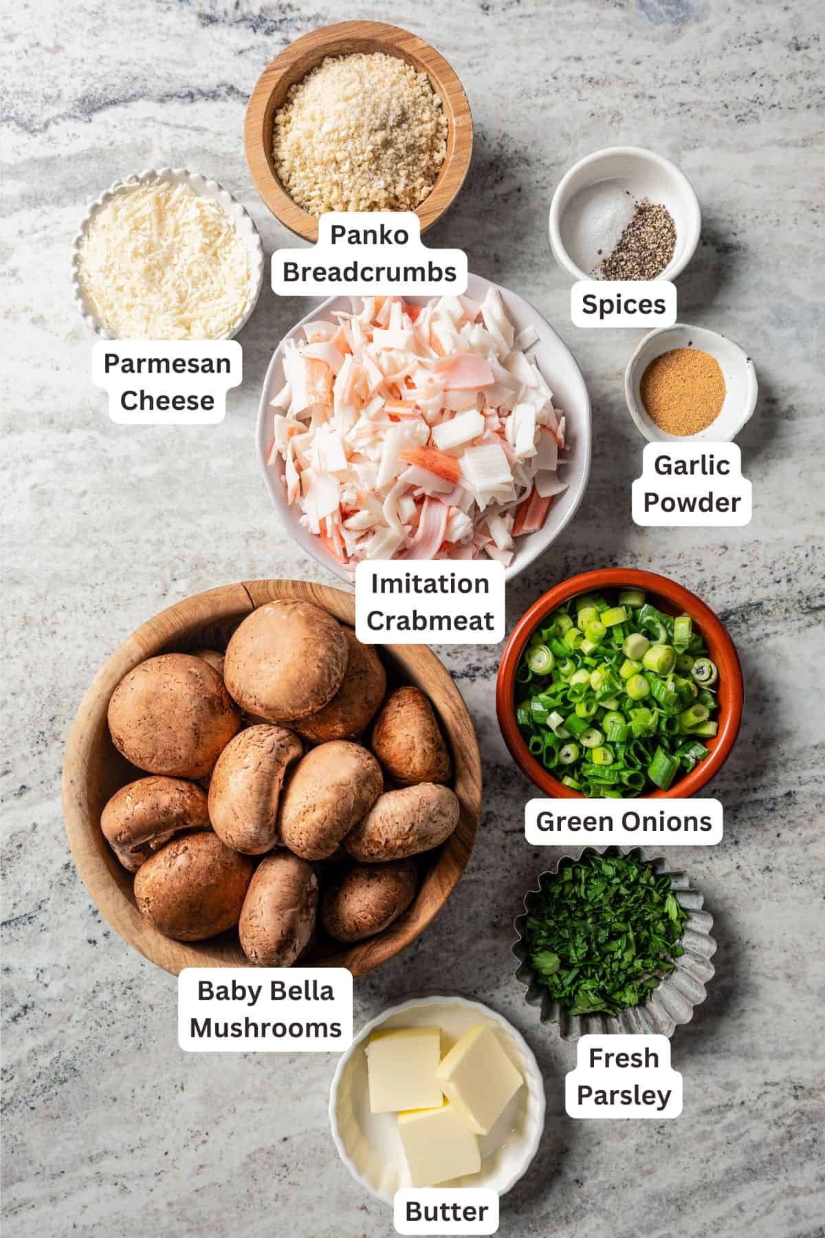 Ingredients for crab stuffed mushrooms with text labels overlaying each ingredient.