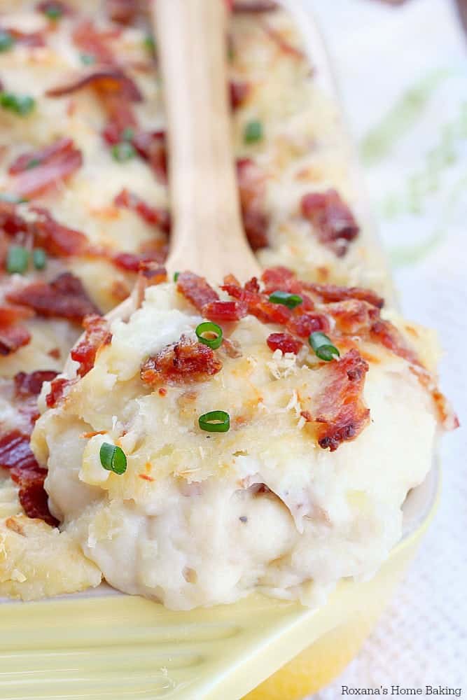 Twice baked cheese and bacon mashed potato casserole in a baking dish