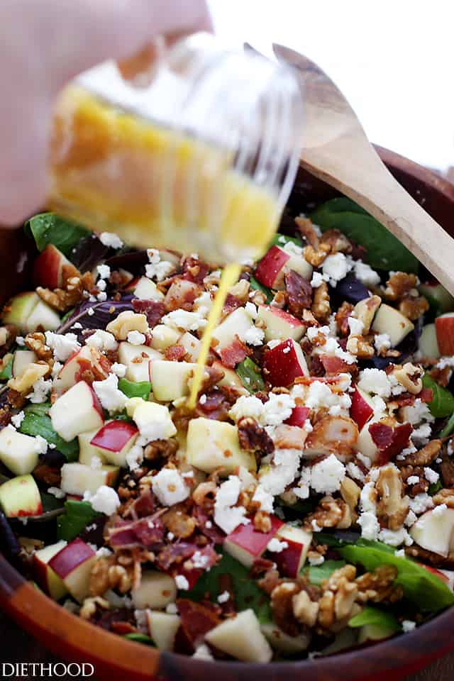 Pouring Maple-Balsamic Vinaigrette over Apples and Bacon Salad