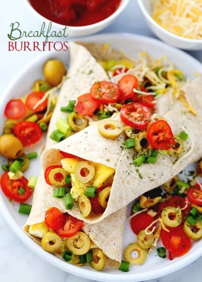 Breakfast Burritos | www.diethood.com | Loaded with eggs, cheese, tomatoes and olives, these delicious burritos are going to be the delicious solution to your busy mornings!