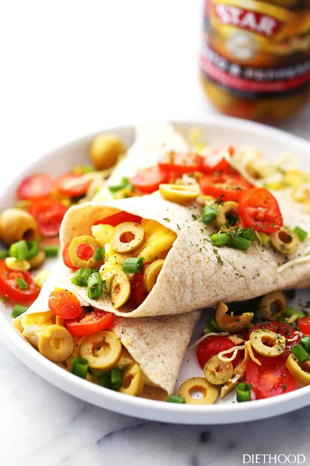 Breakfast Burritos | www.diethood.com | Loaded with eggs, cheese, tomatoes and olives, these delicious burritos are going to be the delicious solution to your busy mornings!