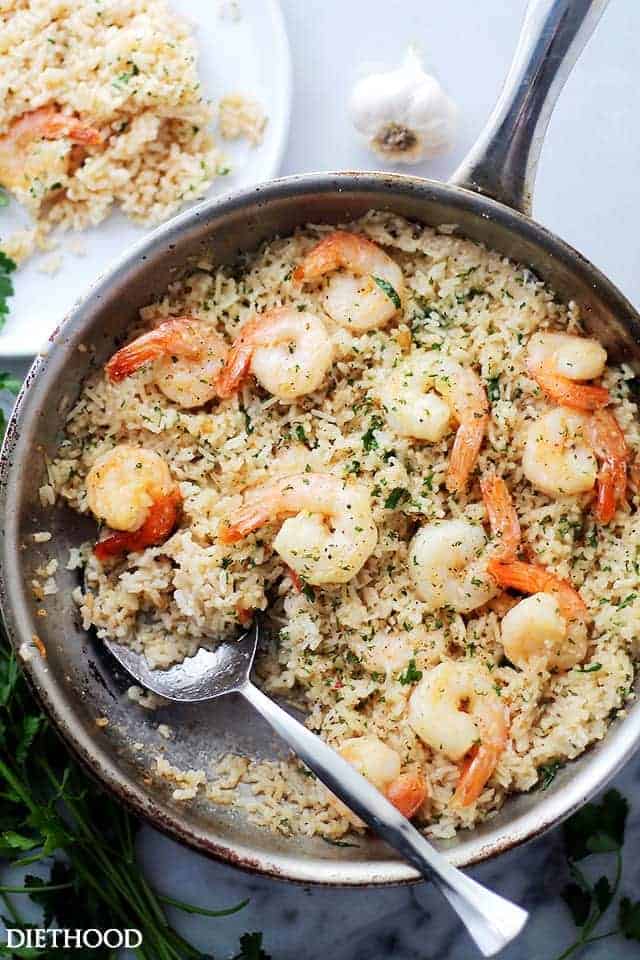 Garlic butter shrimp with rice in a skillet