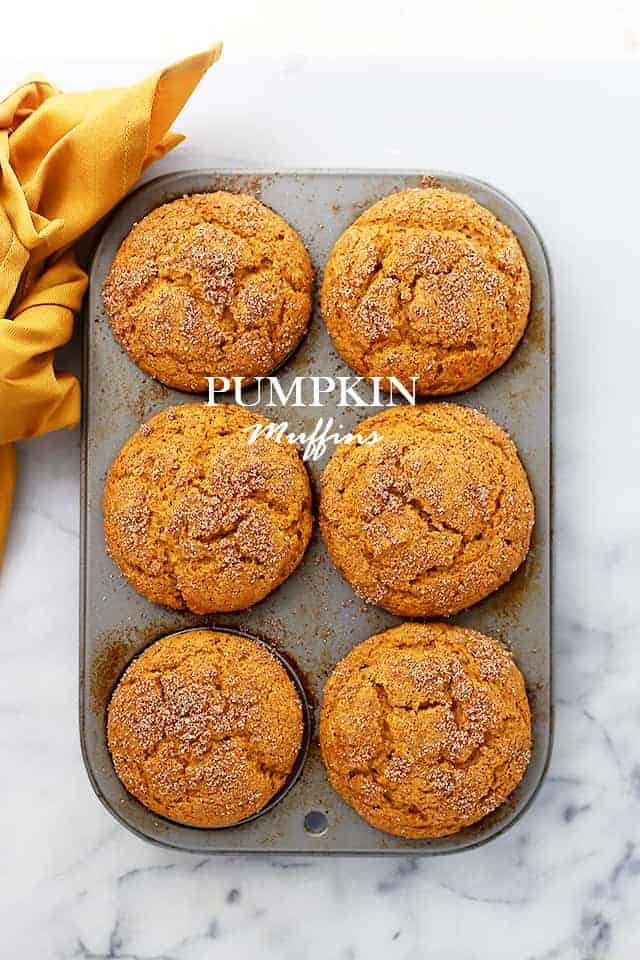 Fresh baked pumpkin muffins in a muffin tray.