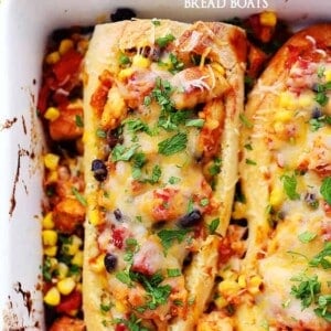 Southwestern Chicken Bread Boats - Stuffed french bread with a hearty, warm and delicious chicken-mixture with tomatoes, black beans, and corn.