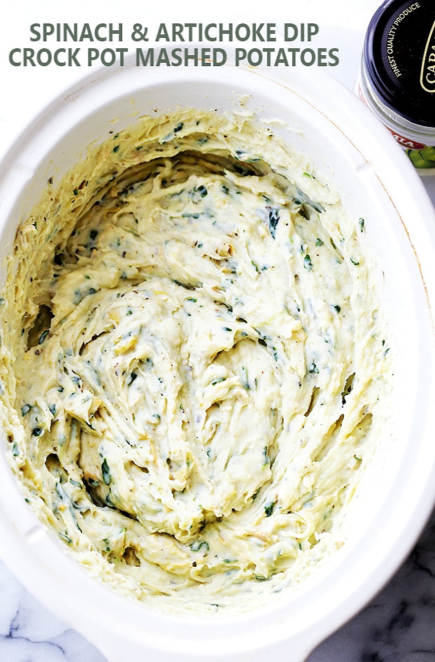 Image of Spinach and Artichokes mixed into Crockpot Mashed Potatoes.