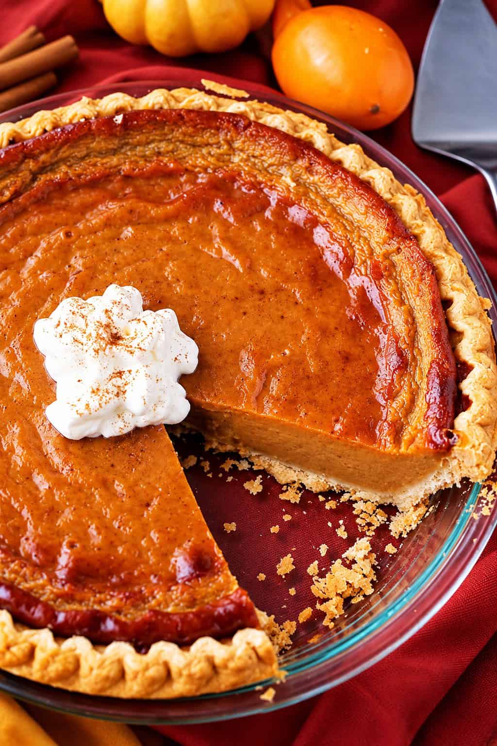 This easy pumpkin pie recipe is perfect for Thanksgiving dessert! It’s a rich and creamy pie with a lighter take on the classic treat. Whole Pumpkin Pie in a pie plate.