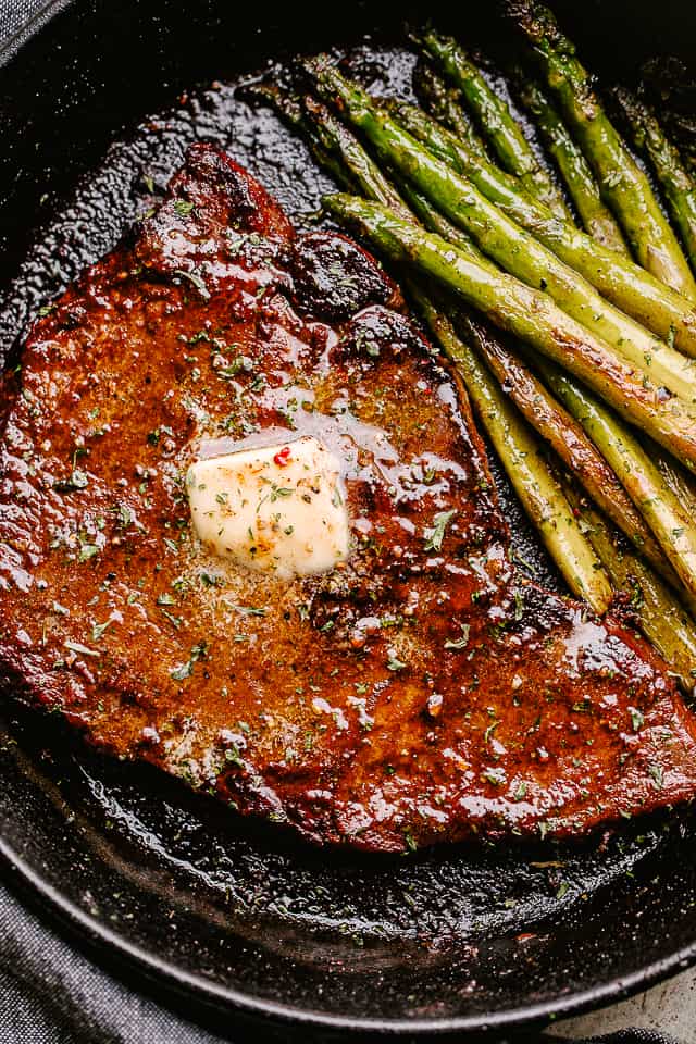 cooking steak in a skillet