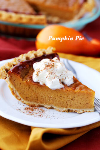 A slice of Healthy Pumpkin Pie that's rich, creamy, and topped with low-fat whipped cream. The ultimate Thanksgiving dessert!