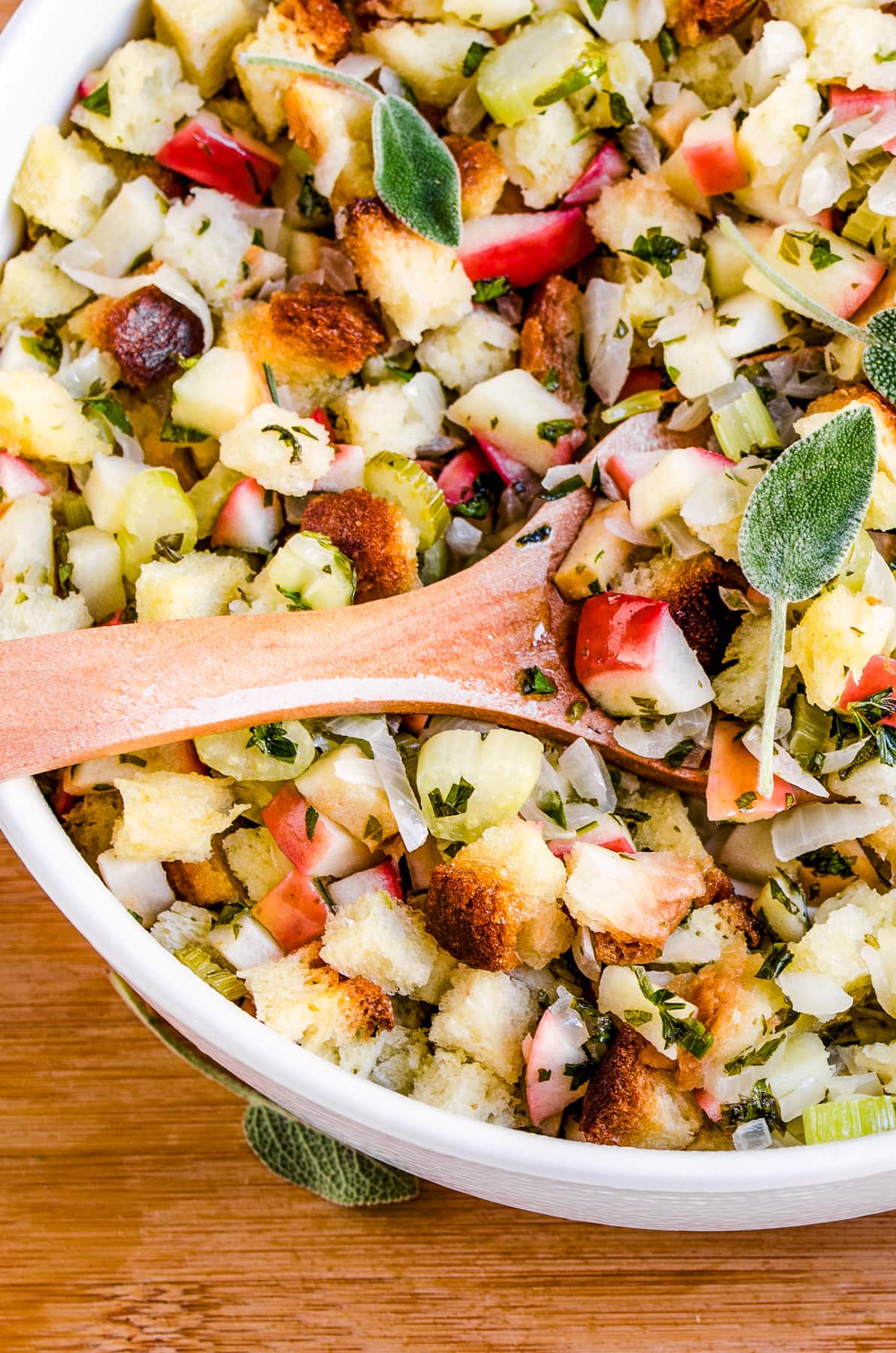 Wooden spoon mixing through stuffing.