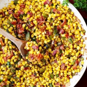 Bacon and Corn Skillet Recipe - Easy and seriously delicious side dish with crispy bacon and deliciously seasoned corn with sage and shallots.