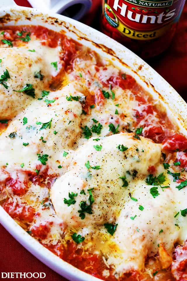 One Dish Chicken Bake - Flavorful chicken baked on a bed of tomatoes and covered in cheese makes for a one-dish dinner the whole family will enjoy.
