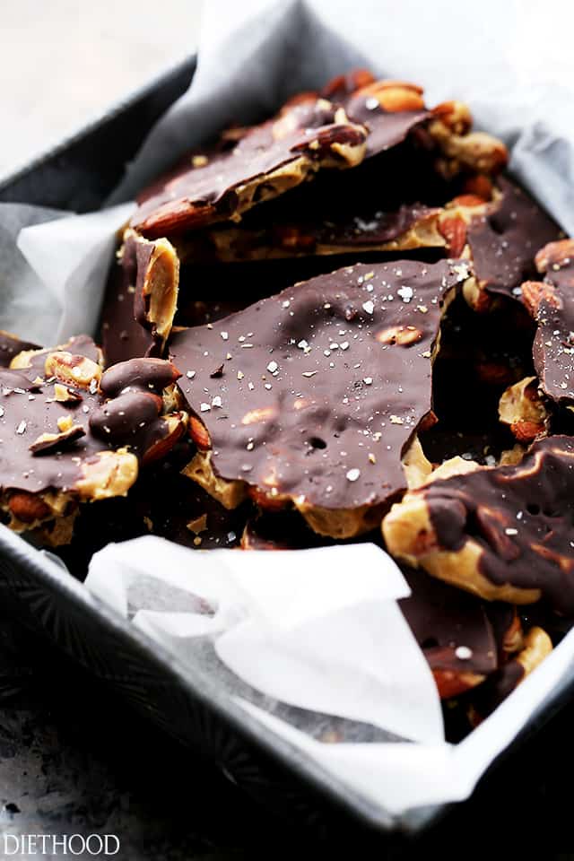 Chocolate Covered Almond Toffee - Made with light brown sugar, dark chocolate and toasted almonds, this toffee recipe results in a deep flavored, crunchy, and delicious treat!