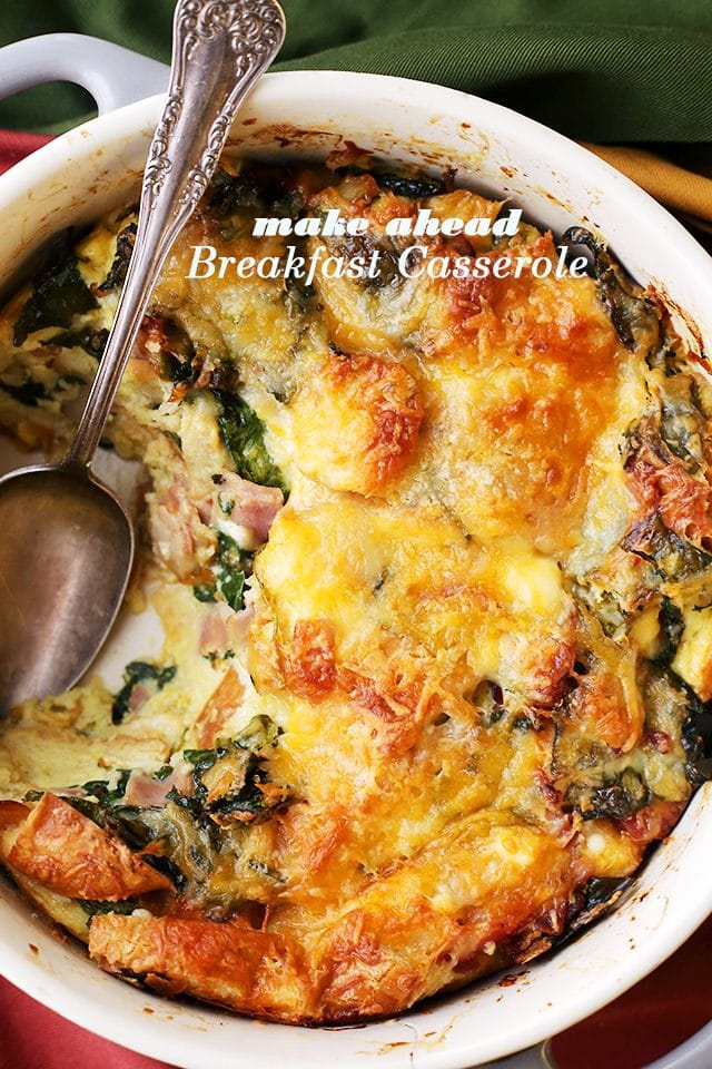 Make Ahead Breakfast Casserole - Easy to prepare, make ahead breakfast casserole chock full of hearty bacon, ham, cheeses and spinach. Prepare this the night before and just pop it in the oven in the morning. Warm, cheesy and delicious!