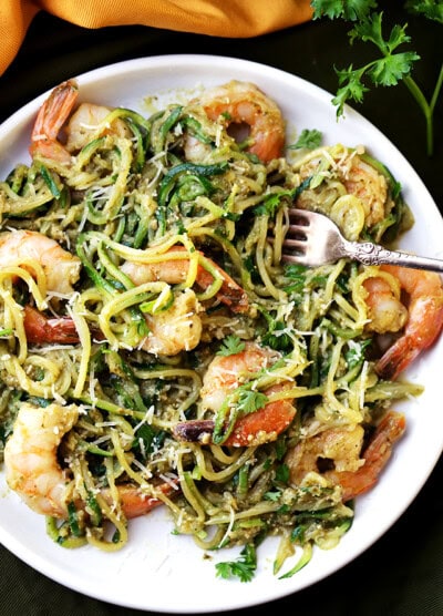 Pesto Zucchini Noodles and Shrimp - Quick and easy dinner recipe with tender zucchini noodles and perfectly sauteed shrimp tossed in a delicious basil pesto sauce.
