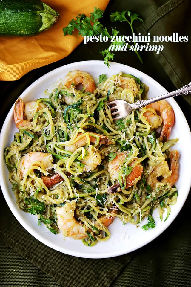 Pesto Zucchini Noodles and Shrimp - Quick and easy dinner recipe with tender zucchini noodles and perfectly sauteed shrimp tossed in a delicious basil pesto sauce.