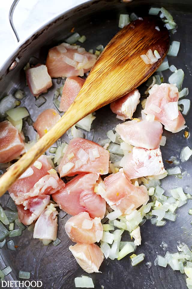 Chicken cooking with garlic and onion.