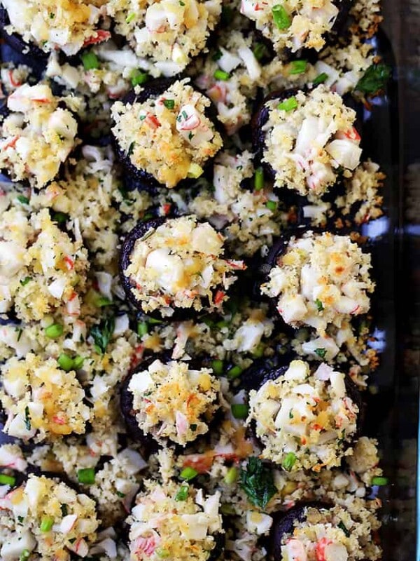 Crab Stuffed Mushrooms - Packed with crab meat and drizzled with garlic butter sauce, these delicious stuffed mushrooms are so easy to prepare, and they make for the perfect appetizer!