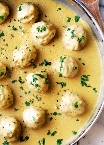 Creamy gravy in the pan with turkey meatballs.