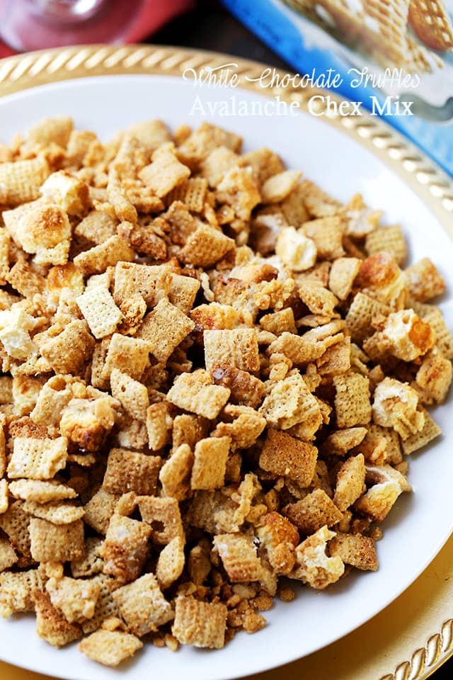 White Chocolate Truffles Avalanche Chex Mix - A glamorous take on the classic Chex™ Mix with the delightfully sweet flavors of white chocolate truffles, cookie butter, soft marshmallows and crunchy gold edible glitter.