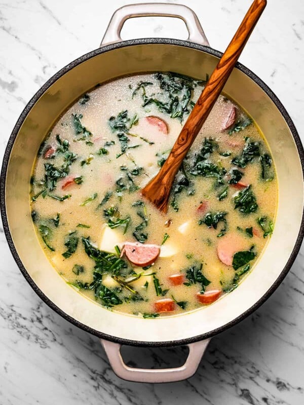 Creamy potato soup cooking in a Dutch oven.