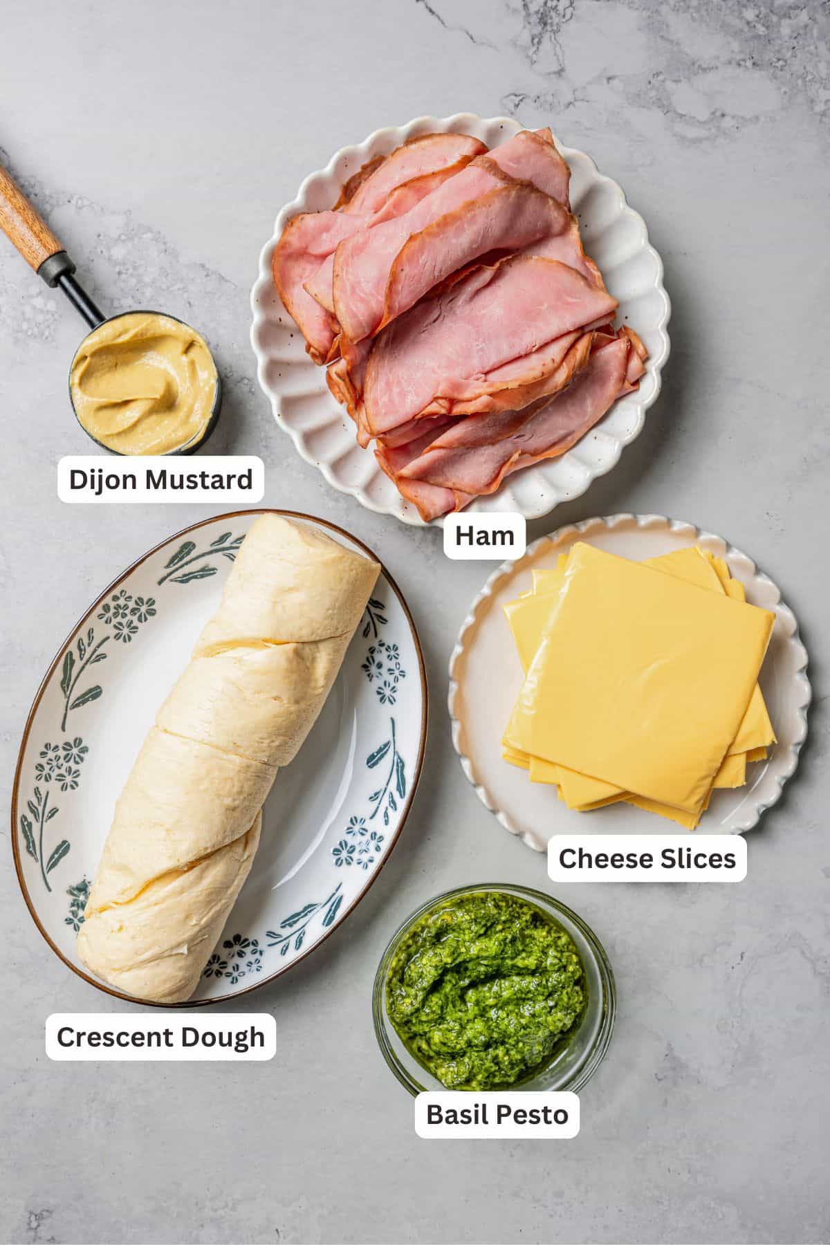 Ham and cheese roll ups ingredients with text labels overlaying each ingredient.