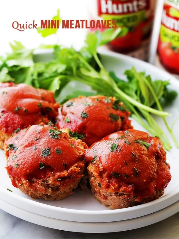 Quick Mini Meatloaves - Quick, easy and delicious mini meatloaves topped with a sweet, yet tangy tomato sauce and baked in muffin cups.