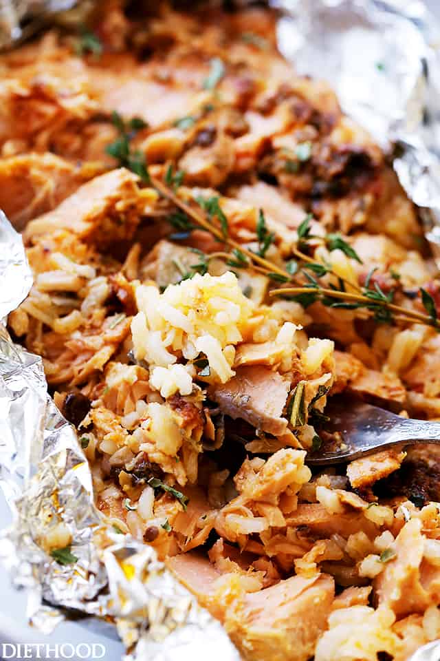 Tomato Pesto Salmon and Rice Recipe Baked in Foil - Incredibly flavorful, quick, 30-minute healthy dinner recipe with tomato pesto, salmon and rice baked in foil.