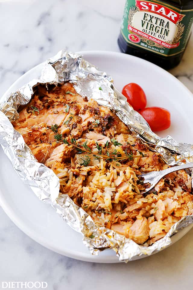 Tomato Pesto Salmon and Rice Recipe Baked in Foil - Incredibly flavorful, quick, 30-minute healthy dinner recipe with tomato pesto, salmon and rice baked in foil.