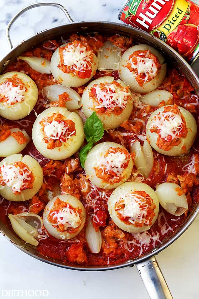 Italian Sausage Stuffed Onions - Filled with Italian sausage, tomatoes, and cheese, these Stuffed Onions are the perfect, most delicious side dish to any meal.