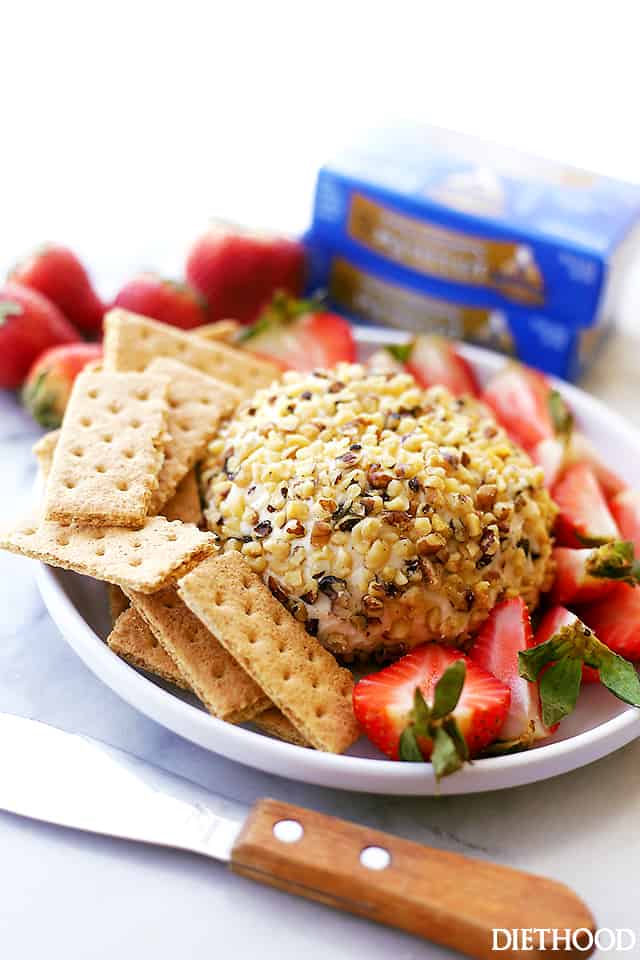 White Chocolate Cheeseball with graham crackers and strawberries on a plate