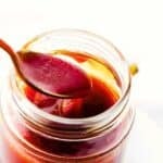 Photo of a jar of homemade honey barbecue sauce with text overlay.