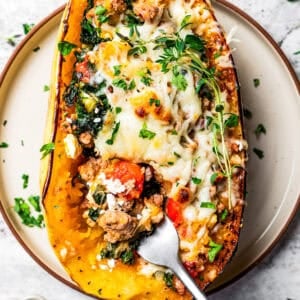 Squash boat with a fork on a plate.