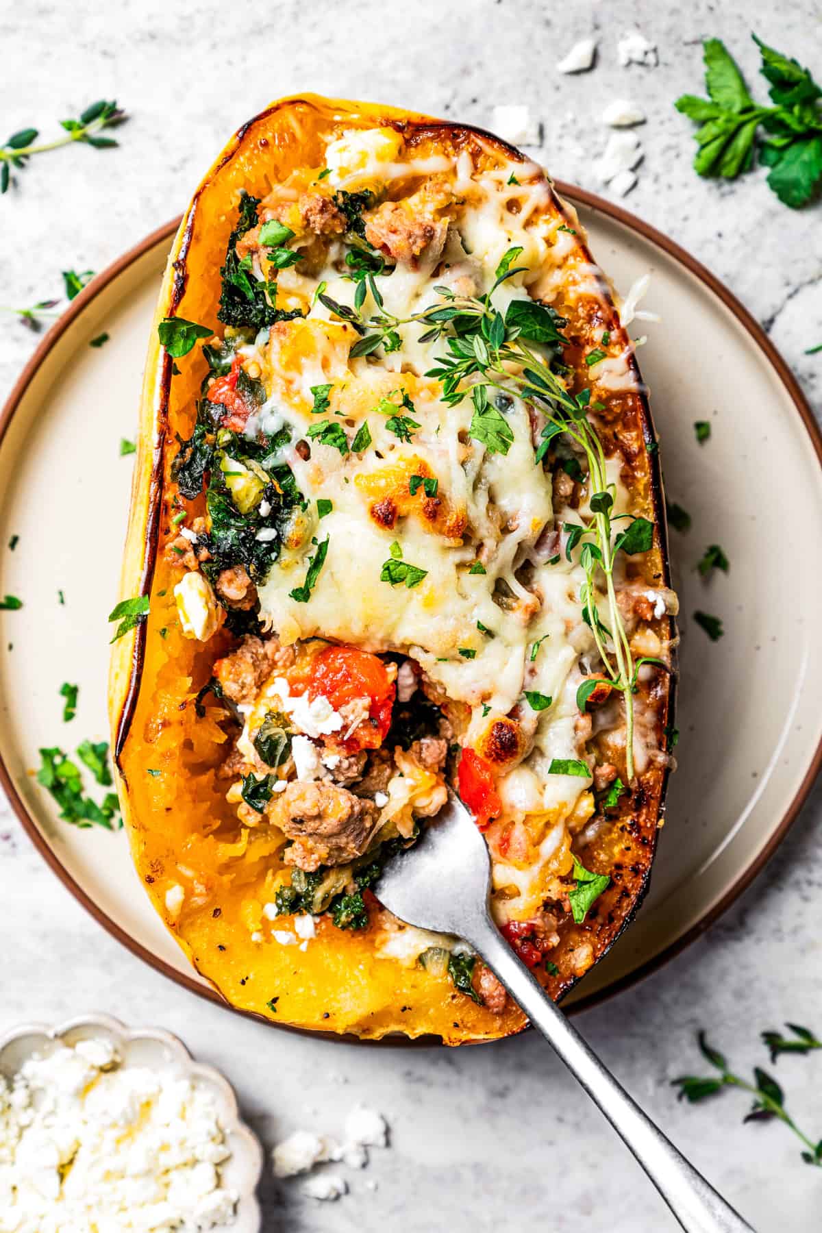 Squash boat with a fork on a plate.