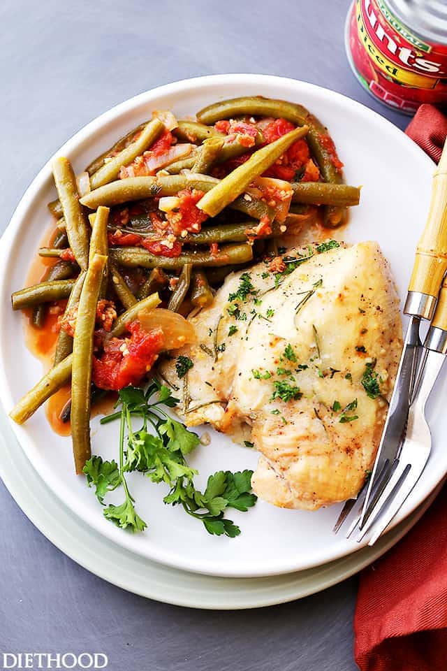 Green Beans and Tomatoes together on a plate with a piece of chicken